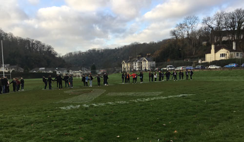 Ground level view of students spelling out are you ok?